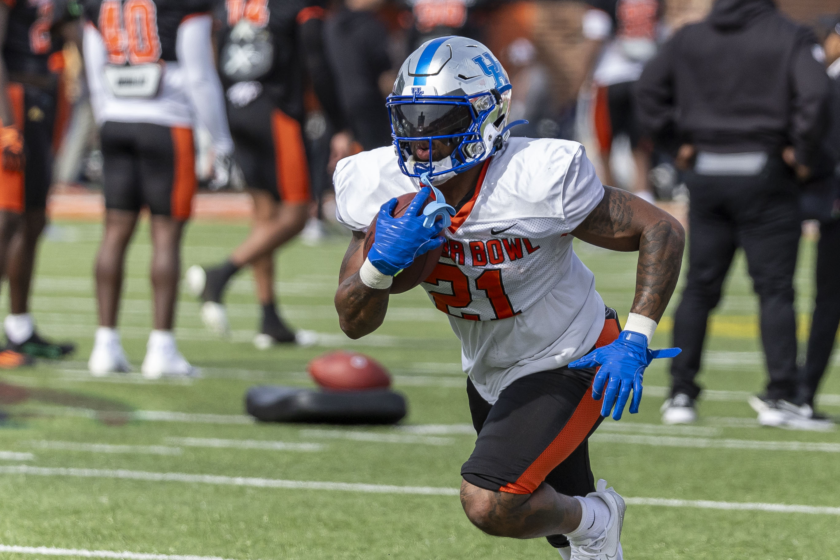 Feb 1, 2024; Mobile, AL, USA; American running back Ray Davis of Kentucky (21) works in running drills during practice for the American team at Hancock Whitney Stadium.